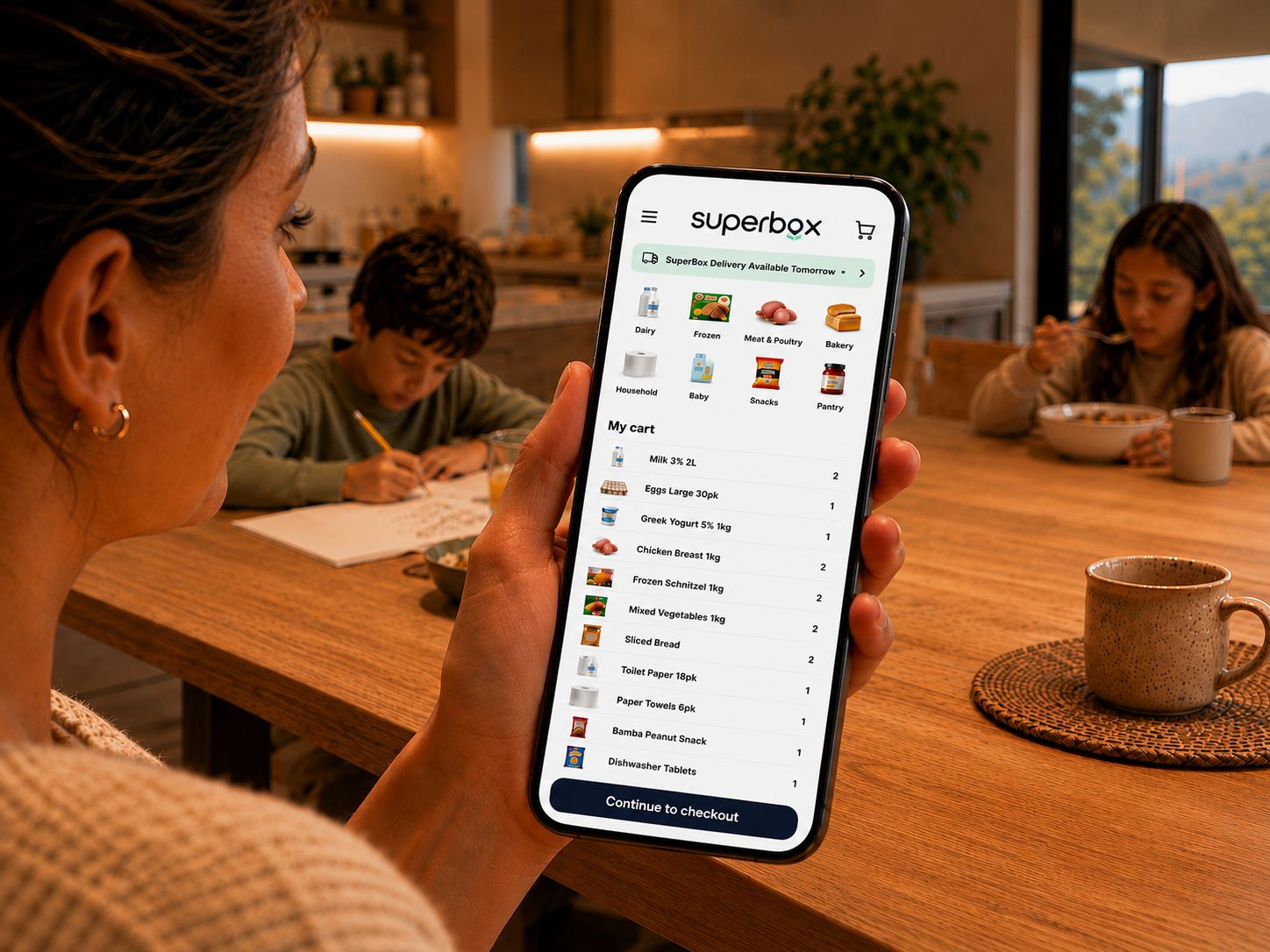 Parent ordering groceries on the SuperBox app at home